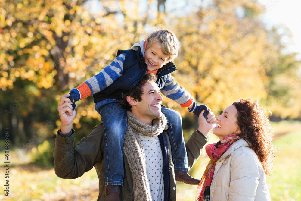 Fototapeta premium Caucasian family walking in park
