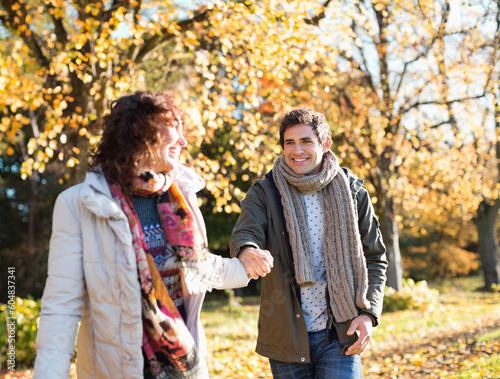 Couple holding hands in park