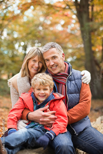 Boy smiling with grandparents in park © KOTO