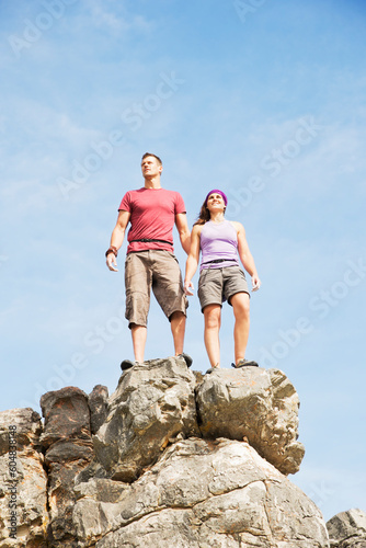 Climbers on rocky hilltop