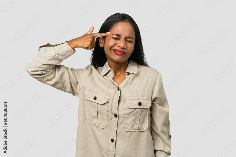 Young Indian woman cut out isolated on white background covering ears with hands. Young Indian woman cut out isolated on white background covering ears with hands.