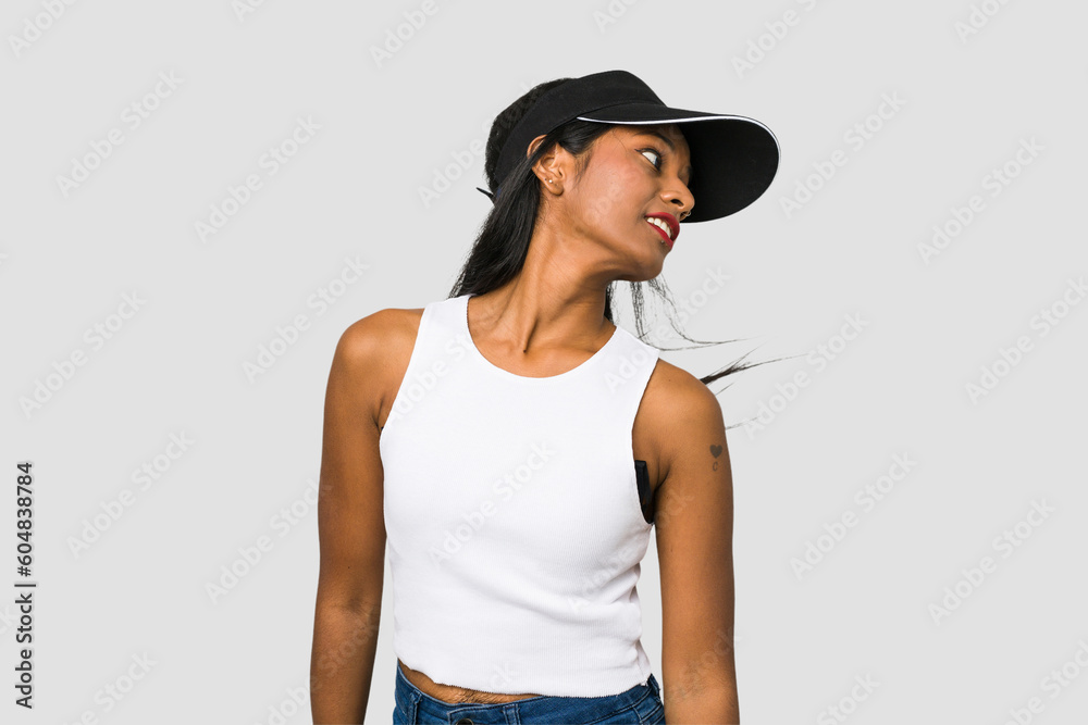 Young Indian woman posing moving her hair cut out isolated on white background Young Indian woman posing moving her hair cut out isolated on white background