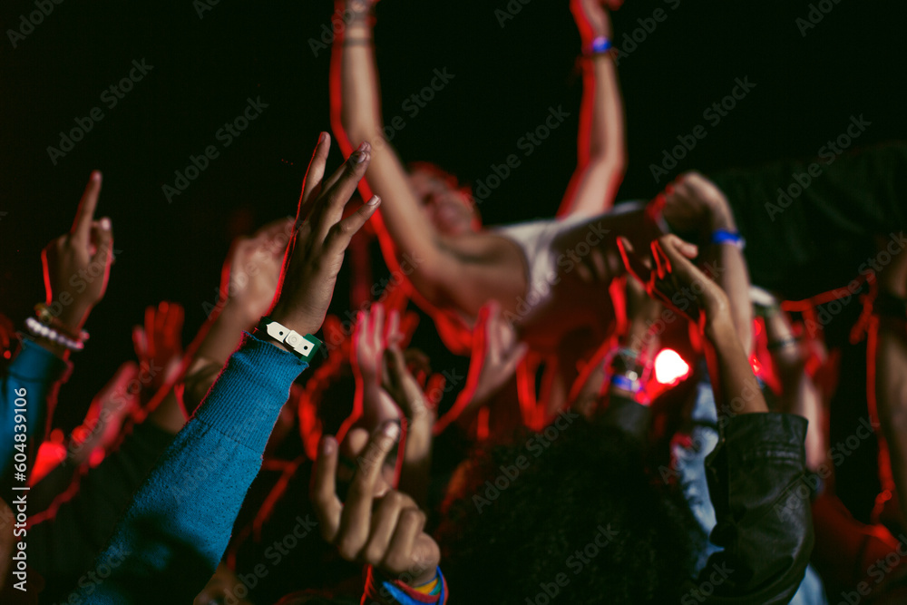 Man crowd surfing at music festival