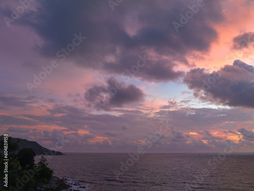 aerial view scene romantic sunset at Kata Noi beach Phuket. .abstract colorful clouds Sky texture in nature background..Sunset with bright colorful light rays and other atmospheric effects.. © Narong Niemhom