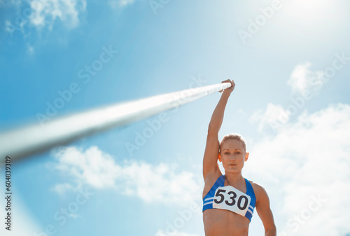 Pole vaulter holding pole photo