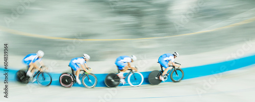 Track cycling team racing in velodrome