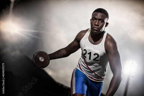 Track and field athlete holding discus