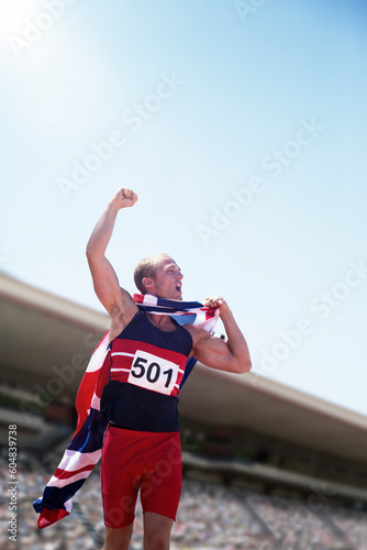 Track and field athlete cheering with British flag