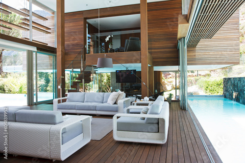 Stampa su tela Lap pool alongside modern living room