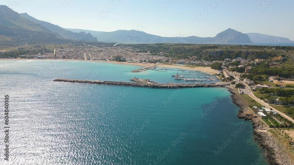 This aerial drone video shows the town of San Vito Lo Capo in Northern Sicily, Italy. The mediterranean town has a beautiful beach. This aerial drone video shows the town of San Vito Lo Capo in Northern Sicily, Italy. The mediterranean town has a beautiful beach.