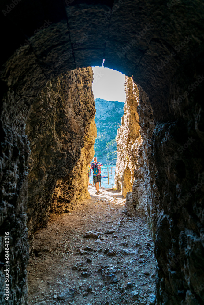 Settlement Novyi Svet, Crimea. Through grotto. Cape Kapchik. Attraction - Golitsyn trail
