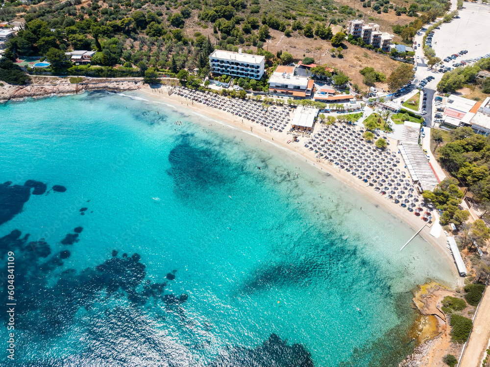 Panoramic aerial view of the beautiful beach of Avlaki at Porto Rafti, Greece, with emerald sea, a popular summer destination for tourists and Athenians