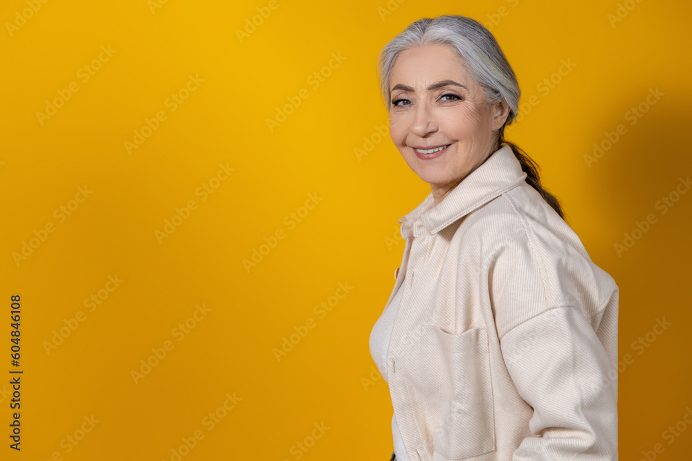 Fototapeta premium Waist up picture of a good-looking senior woman