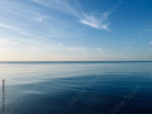 Wallpaper Mural Blue sea horizon with some light clouds, seascape background Torontodigital.ca