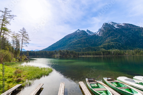 Boat dock with rowboats on Hintersee in Ramsau with a mountain idyll (Bavaria, Germany)