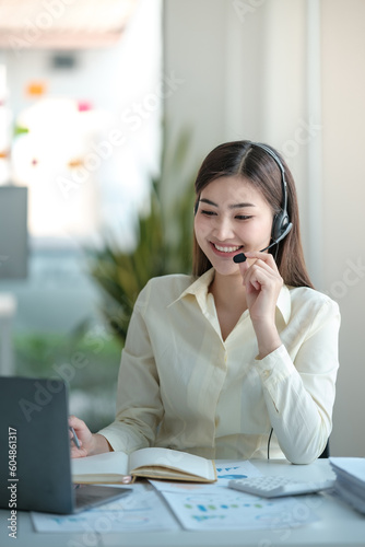 Wallpaper Mural Portrait of happy smiling female customer support phone operator at workplace. Asian Torontodigital.ca