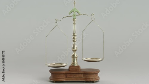 An ornate brass justice scale with a wooden base teetering on imbalance on a white isolated background