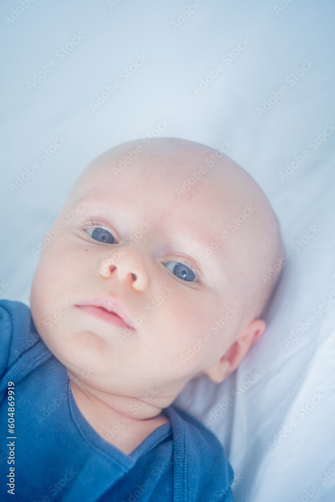 portrait of a cute baby with blue eyes	