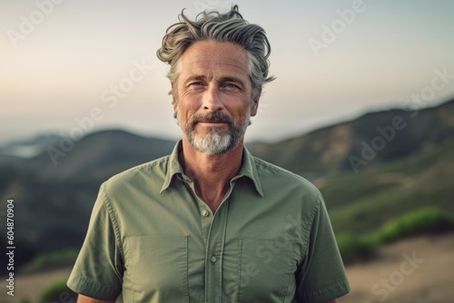 Conceptual portrait photography of a glad mature man wearing a casual short-sleeve shirt against a national park background. With generative AI technology