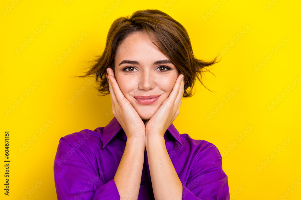 Closeup photo of lovable attractive lady touch her cheekbones admire wear office blouse clothes isolated yellow color background Closeup photo of lovable attractive lady touch her cheekbones admire wear office blouse clothes isolated yellow color background