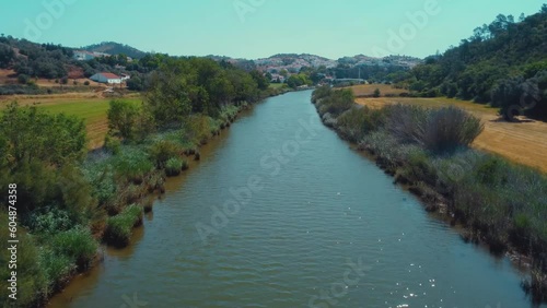 The lush vibrant Mira River flowing towards Odemira  photo