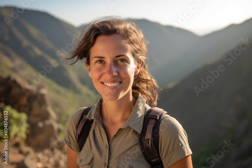 Environmental portrait photography of a glad girl in her 30s wearing a casual short-sleeve shirt against a scenic mountain trail background. With generative AI technology