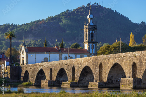 Church of Santo Antonio da Torre Velha and Roman bridge over Lima River in Ponte de Lima town, Portugal photo