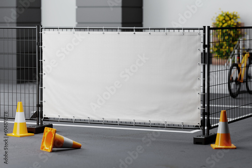 Fototapeta Advertising banner on a metal fence with traffic cones mockup