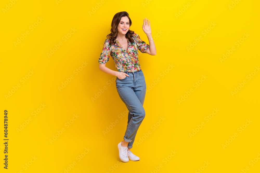 Full size photo of adorable sweet lady standing posing waving hand saying hello to her friends isolated vibrant color background - obrazy, fototapety, plakaty 