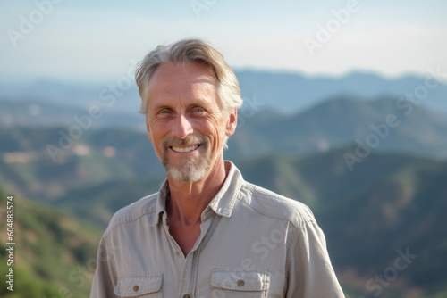 Environmental portrait photography of a glad mature man wearing a casual short-sleeve shirt against a scenic mountain overlook background. With generative AI technology