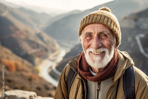 Medium shot portrait photography of a glad old man wearing a warm beanie or knit hat against a scenic mountain overlook background. With generative AI technology