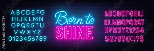 Born to Shine neon lettering on brick wall background.