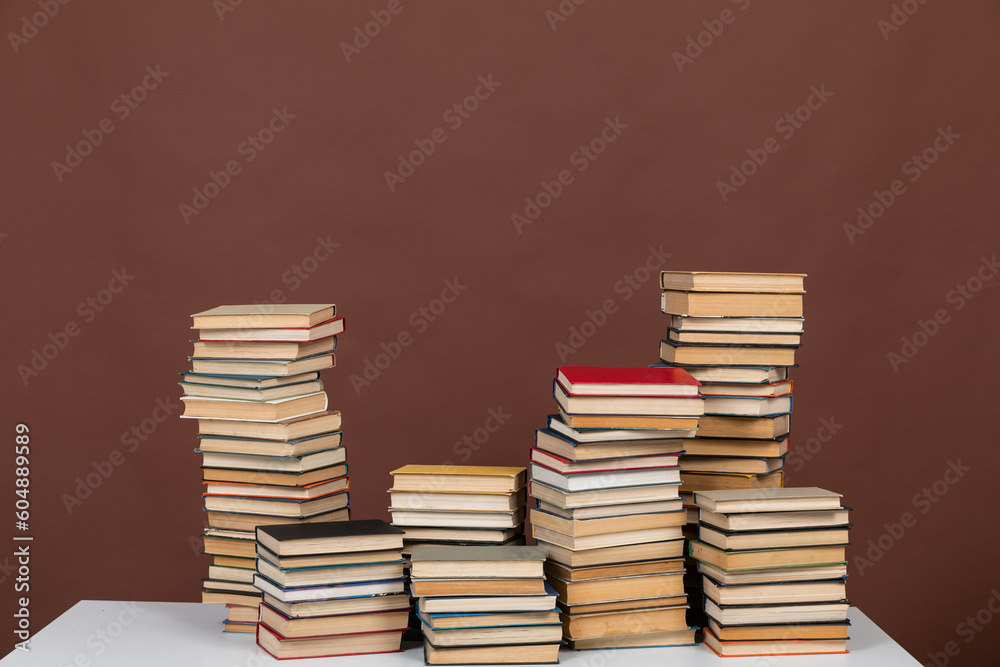 science learning library education stack of books on brown background