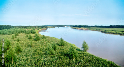 Landscape with farm and pond