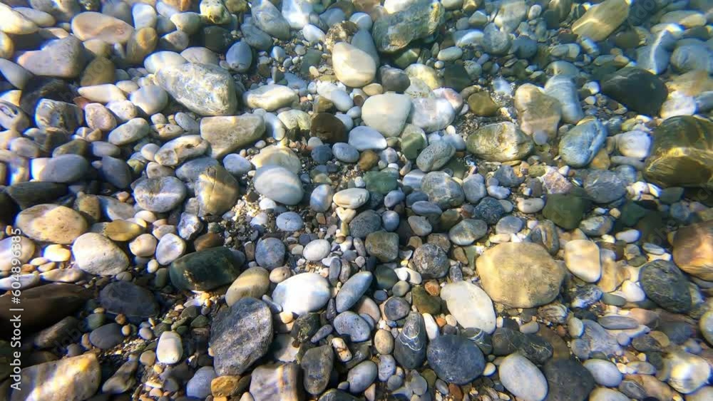 Underwater slow motion video of pebbles on the bottom in the Mediterranean sea. Crete, Greece. Underwater slow motion video of pebbles on the bottom in the Mediterranean sea. Crete, Greece.