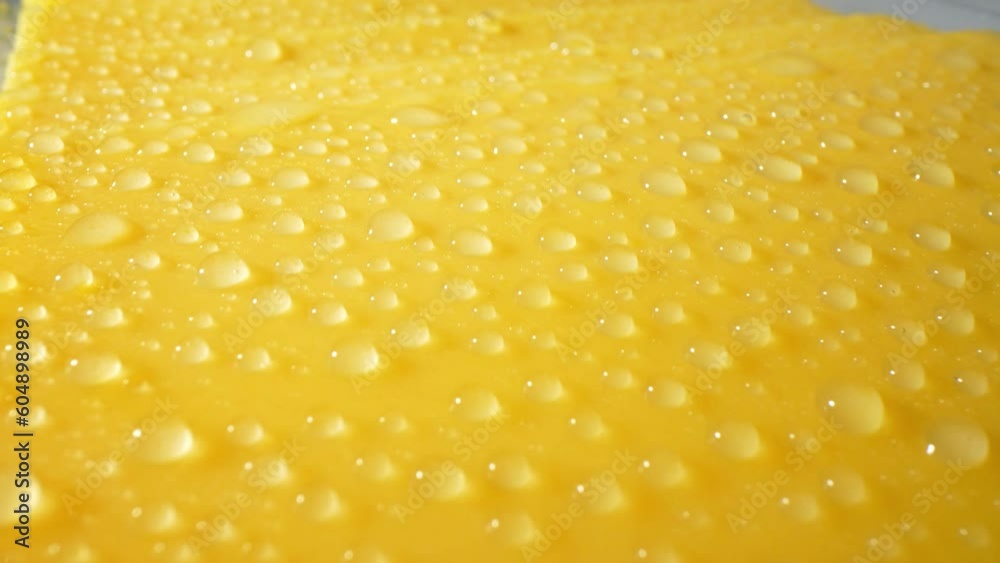 A macro video shot with a probe lens capturing water droplets on Cheese slices creates a visually stunning. The probe lens, known for its unique perspective and extreme close-up capabilities. 4K A macro video shot with a probe lens capturing water droplets on Cheese slices creates a visually stunning. The probe lens, known for its unique perspective and extreme close-up capabilities. 4K