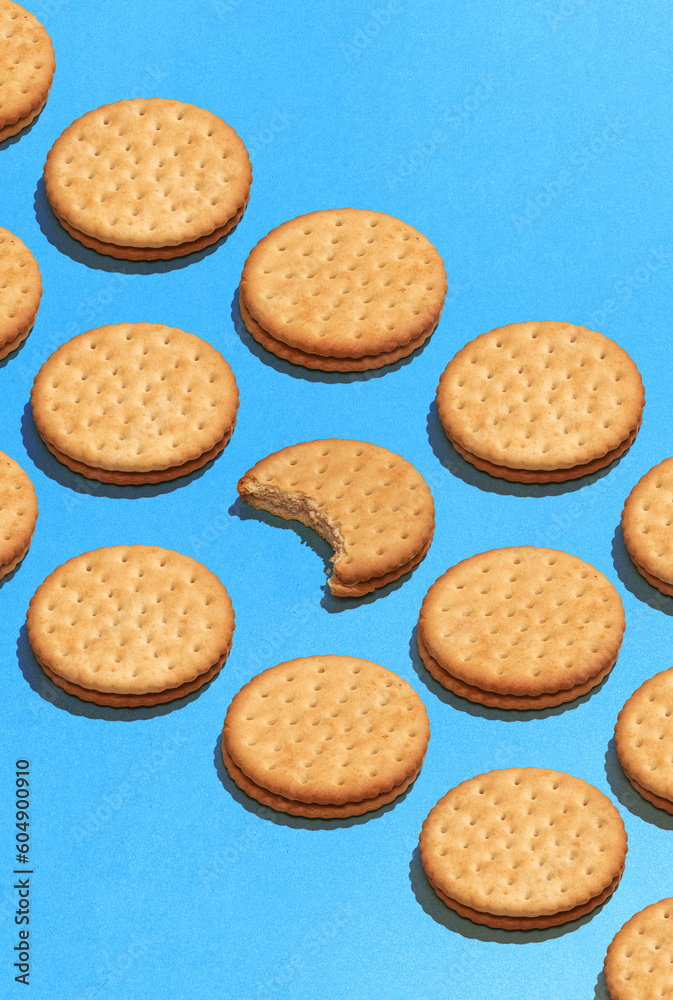 Pop art with cookies over violet background flat lay top-down composition. Confectionery product food pattern
