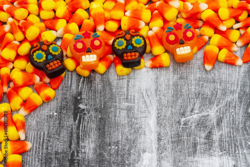 Candy corn with skulls Halloween background