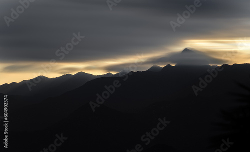 Majestic Mountain Peaks Silhouetted Against a Colorful Sky