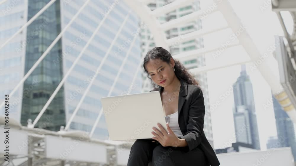 Portrait of young asian businesswoman working on laptop Portrait of young asian businesswoman working on laptop
