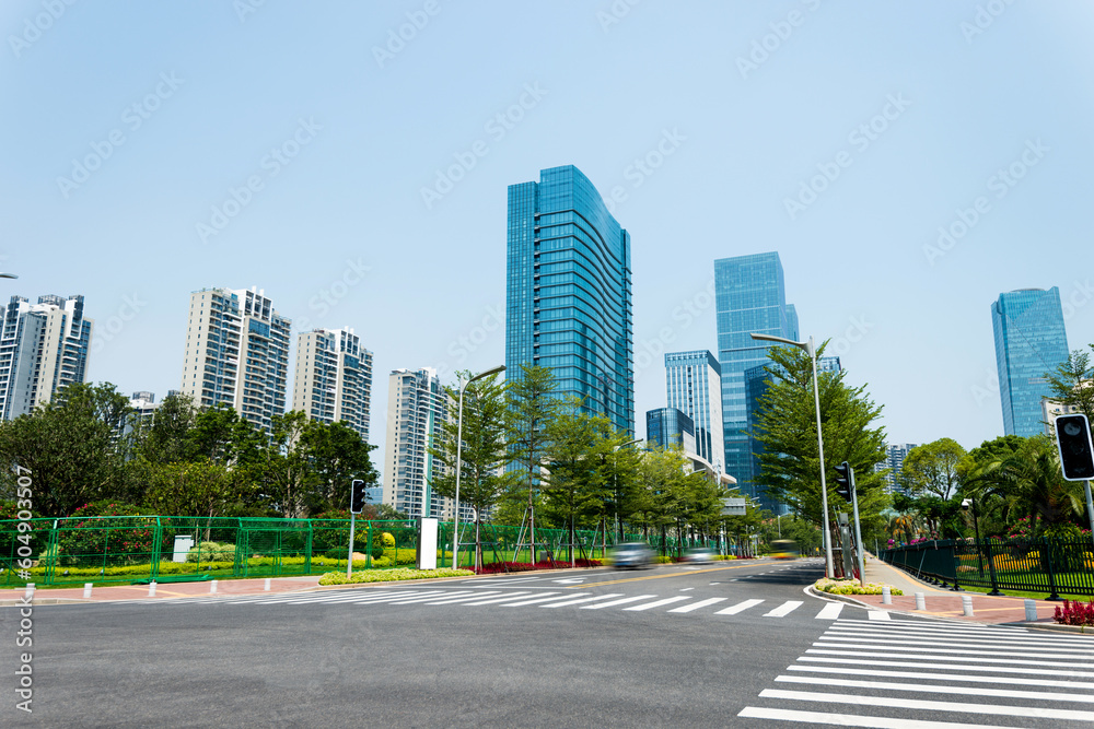Empty road with zebra crossing and skyscrapers Empty road with zebra crossing and skyscrapers