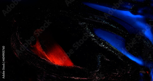 Black red blue paint flow abstract background. Shiny glitter sparkling in black dark ink liquid. Elegant dark backdrop. Shiny particles flowing in liquid. Fluid art. Acrylic move pattern