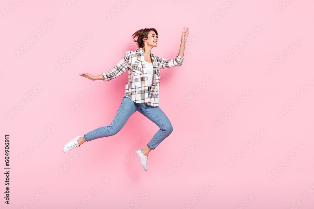 Full size body cadre of bob brown hair lady running lightness freedom vacation after hard business days isolated on pink color background