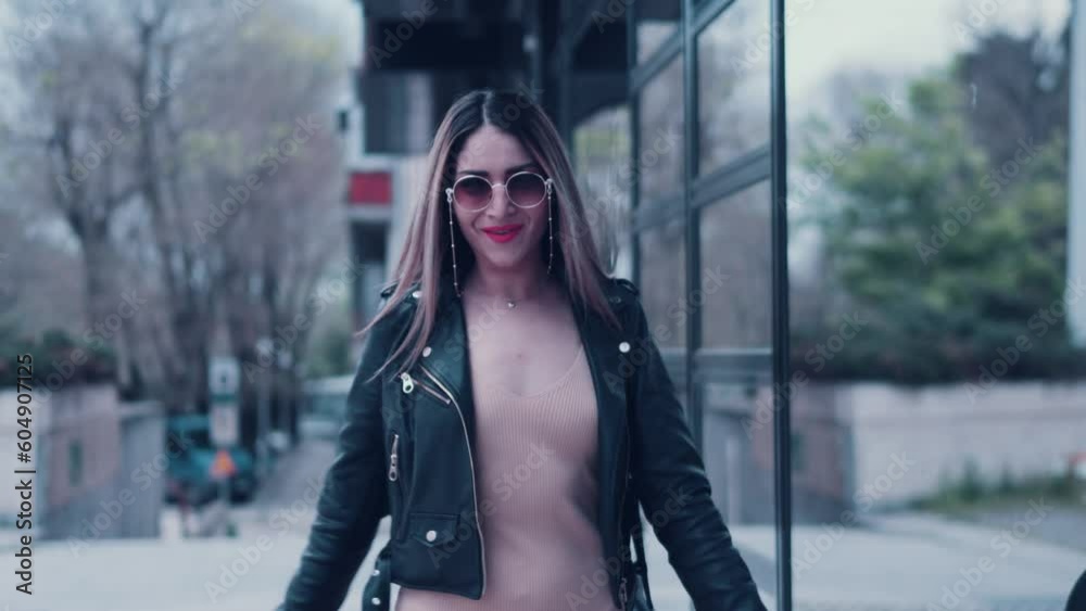 Beautiful attractive young happy woman walking with confidence outdoor infront of office building smiling and playing with the camera looking stylish and sexy
Beautiful attractive young happy woman walking with confidence outdoor infront of office building smiling and playing with the camera looking stylish and sexy