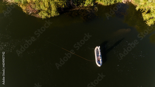 fisherman catching bass off a boat