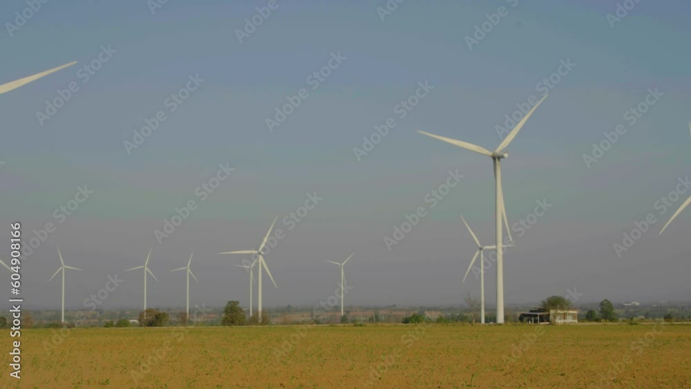 Large wind turbines producing clean sustainable energy. Alternative energy. Wind turbines generating electricity wind energy. Clean renewable energy technologies. Wind power plants Large wind turbines producing clean sustainable energy. Alternative energy. Wind turbines generating electricity wind energy. Clean renewable energy technologies. Wind power plants