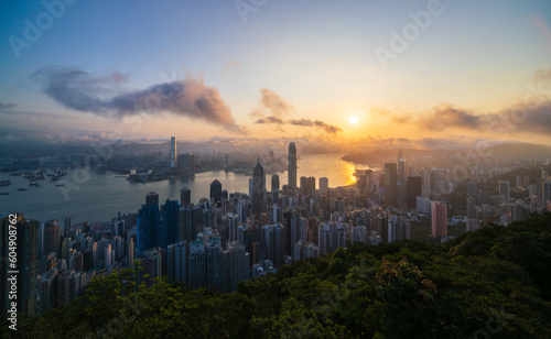 Aerial view of Hong Kong Central district and Victoria Harbour at sunrise, China