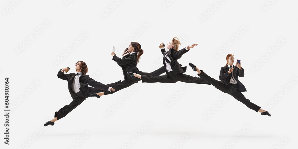 Portrait with group of beautiful women, ballet dancer in classical suit jumping in twine over white color studio background. Concept of business, office lifestyle, success - obrazy, fototapety, plakaty 