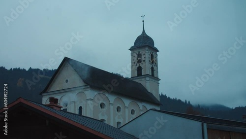 Time lapse 24h church with clouds & sun - Laax, Switzerland - Graded