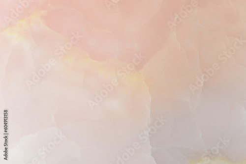 Light pink blurred background made of pink jade or Nephrite